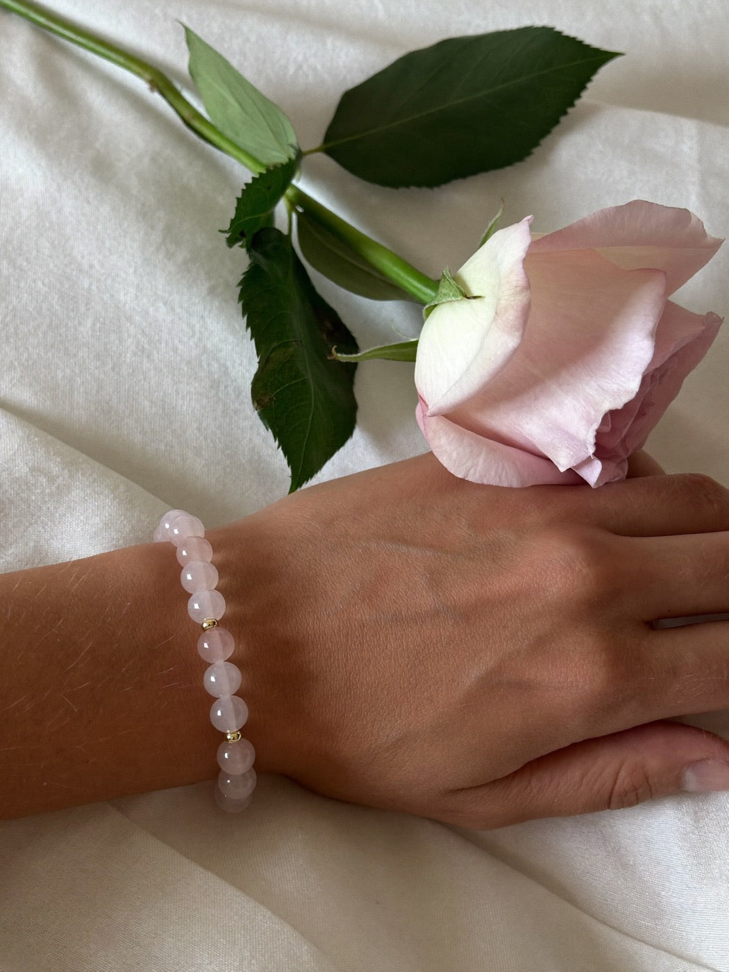 Love & Self-Love crystal bracelet on a wrist
