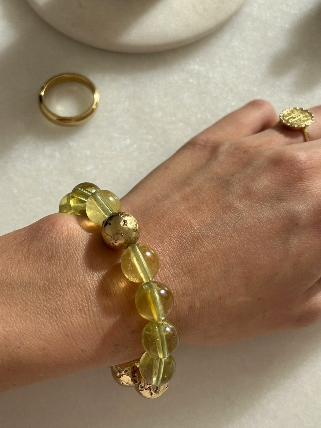 Abundance & Wealth crystal bracelet on a wrist